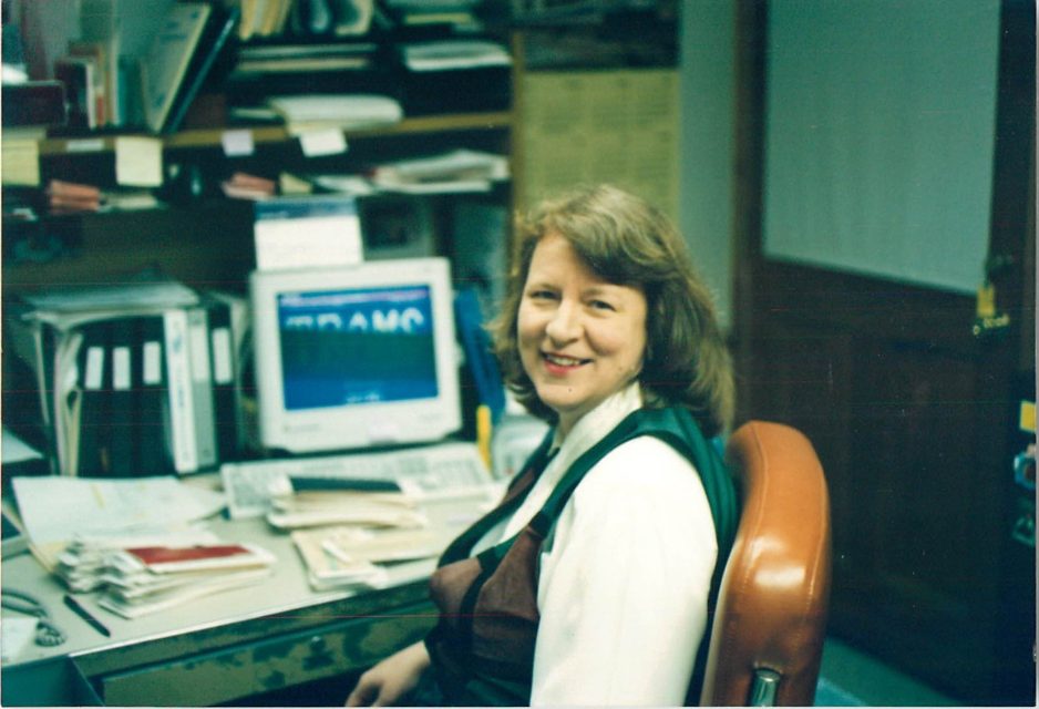 Debbie Bush at her desk in the early years